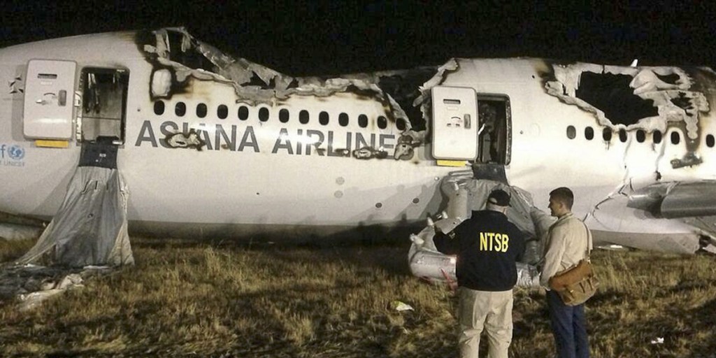 Investigators at the scene of the Asiana Flight 214 crash at San Francisco International Airport.