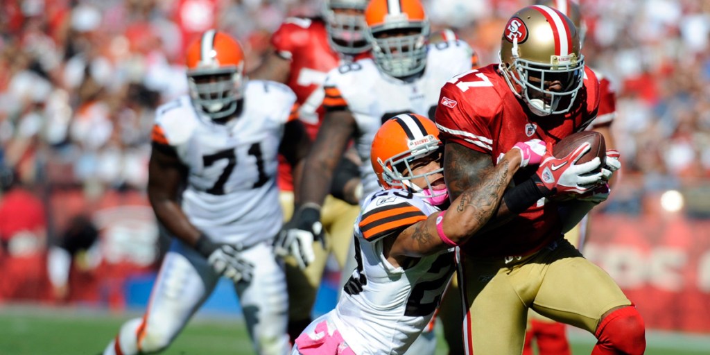 A Cleveland Browns defender hangs on
