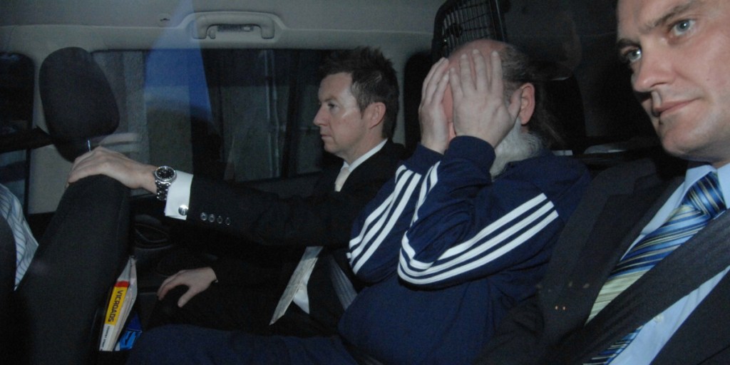 Derek Percy (centre) leaves St Kilda Road Police Station in Melbourne in 2008. Photo: AAP