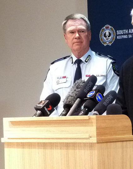 A file photo of John Rau (centre) with Police Commissioner Gary Burns and Education Minister Jennifer Rankine.