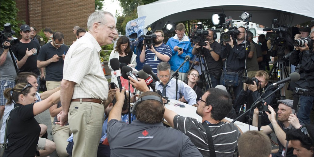 Edward Bukhardt, CEO of Montreal, Maine and Atlantic Railways Inc, speaks to the media after arriving in the devastated town of Lac -Megantic.