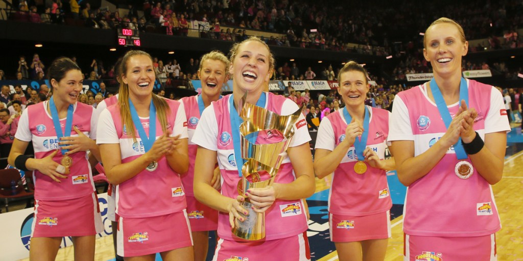 Erin Bell of the Adelaide Thunderbirds holds the Championship trophy.