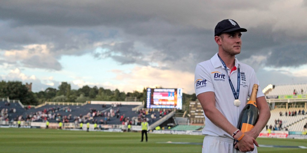 Painful sight: England's bowling hero Stuart Broad with a giant bottle of champagne.