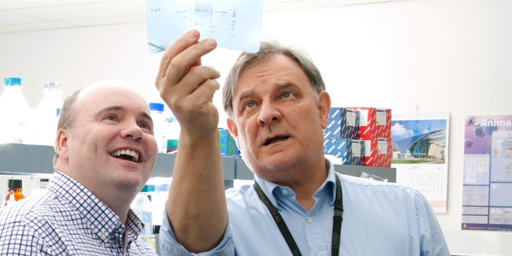 Professor Peter Gunning (right) in his lab with Peter Neilson from the Kids’ Cancer Project.