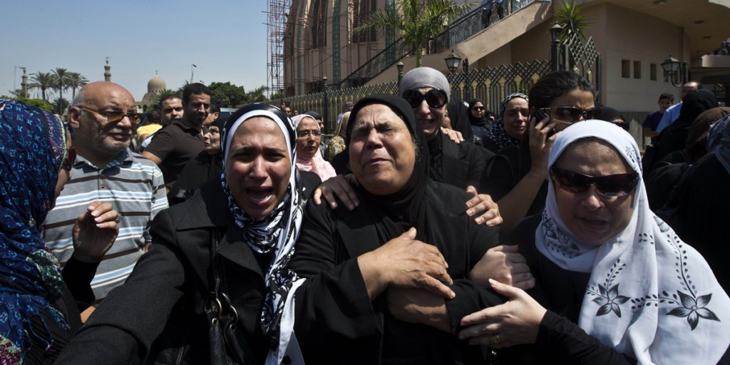 Mourning relatives of the four policemen killed during clashes with Muslim Brotherhood supporters earlier in the week.