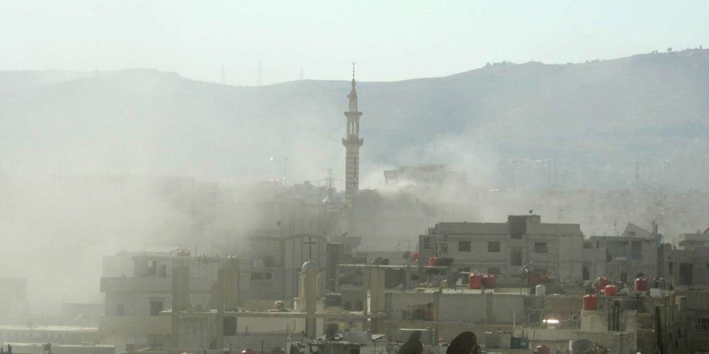 A handout image released by the Syrian opposition's Shaam News Network shows smoke above buildings following what Syrian rebels claim to be a toxic gas attack by pro-government forces in eastern Ghouta, on the outskirts of Damascus.