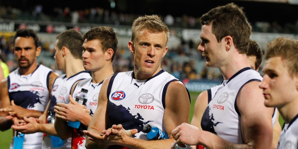 Nathan Van Berlo with Patrick Dangerfield (r) after the West Coast match