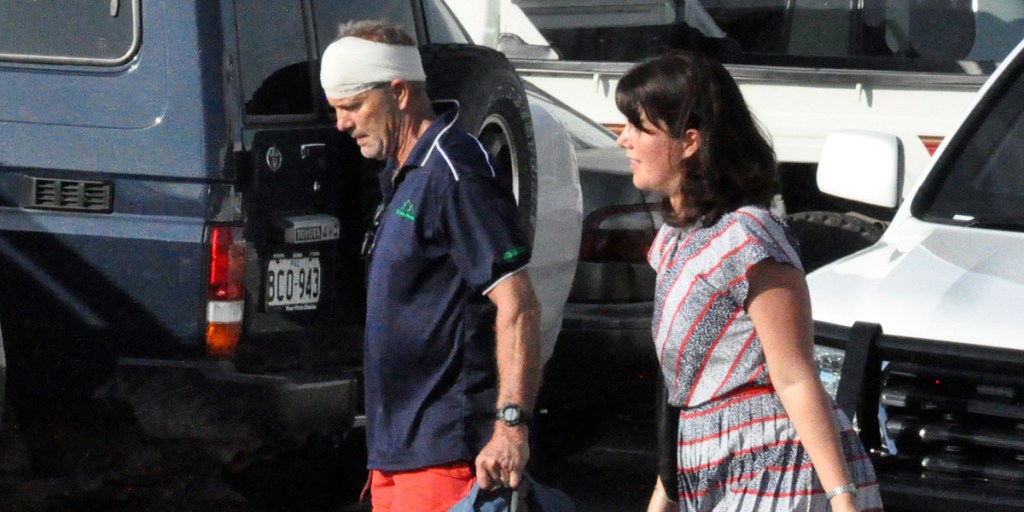 One of eight men from a group of Australian and New Zealand trekkers arrives in Port Moresby, a day after they were attacked by bandits.