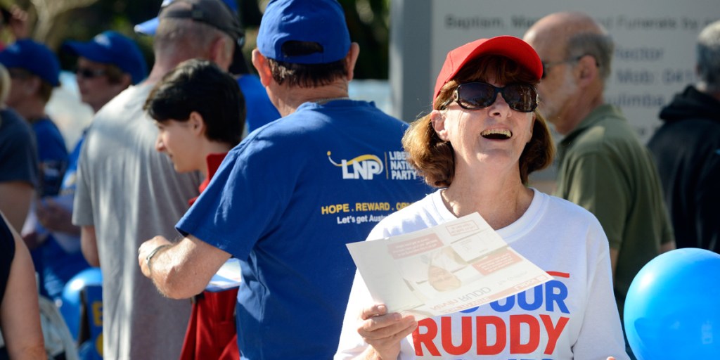 Volunteers handing out 'how to vote' cards in Kevin Rudd's Brisbane seat of Griffith.