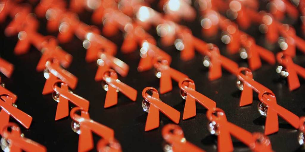 World Aids Day ribbon badges: despite campaigns, Australia's HIV infection rate is climbing.