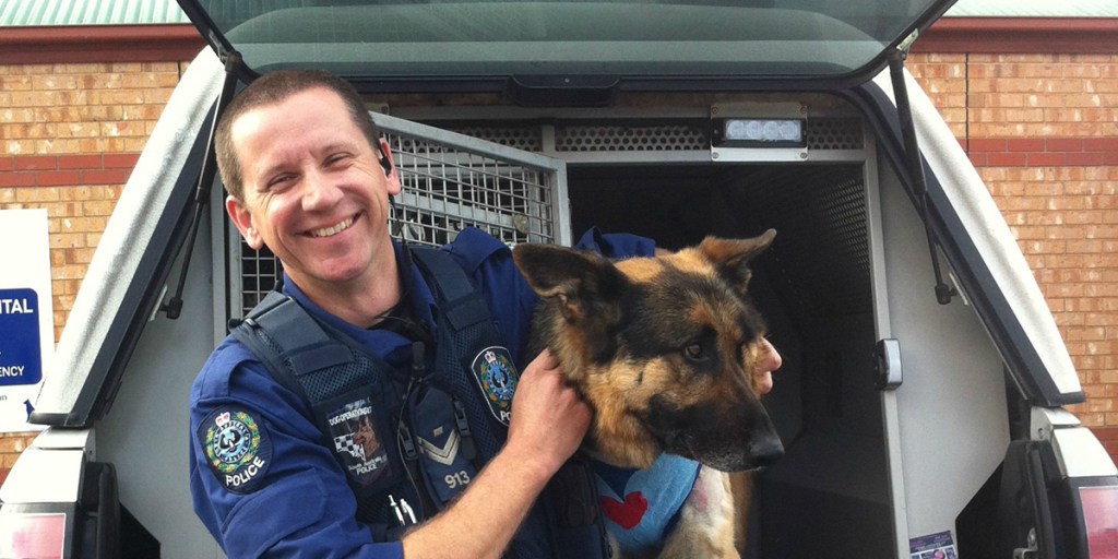 Senior constable Simon Rosenhahn with police dog Koda. Koda was stabbed while helping to chase a man wanted over a series of home break-ins. 