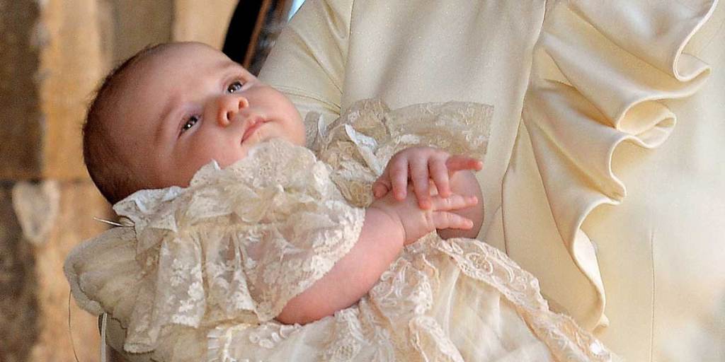 Catherine, Duchess of Cambridge, arrives holding her son Prince George of Cambridge at Chapel Royal in St James's Palace, ahead of his christening.