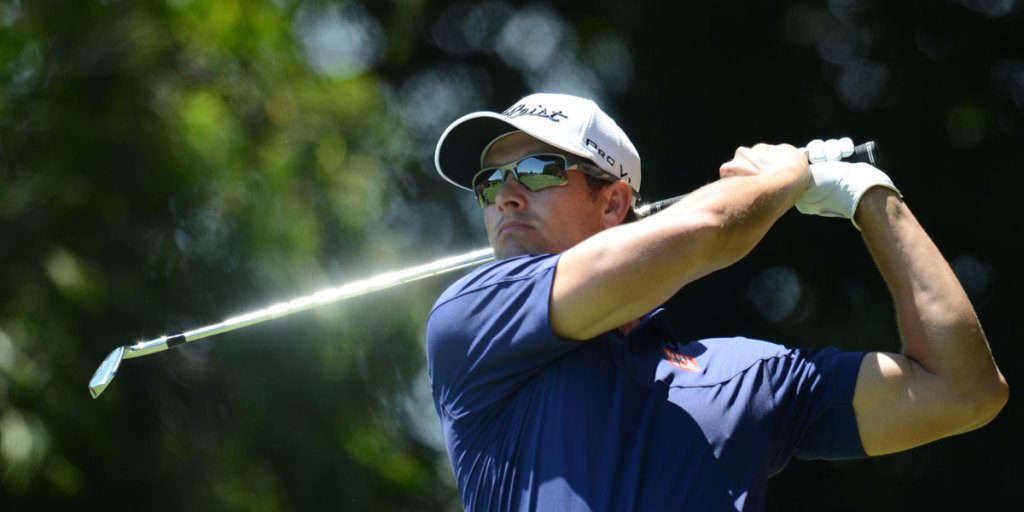Australian golfer Adam Scott in action during his record-breaking first round of the Australian Open Golf championship at the Royal Sydney Golf Club.