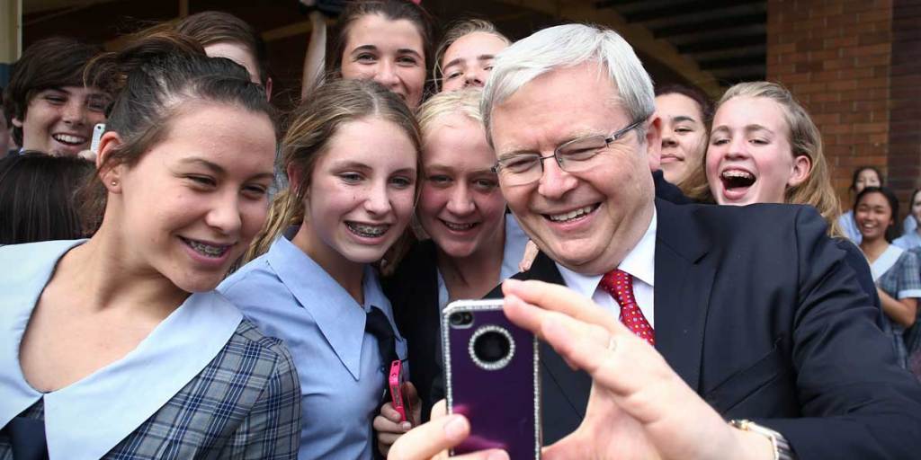 Then Prime Minister Kevin Rudd poses for a selfie with school students during the federal election campaign in September.