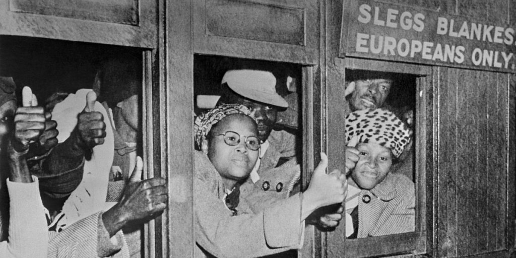Protesters take part in the civil disobedience campaign, in June 1952, in Johannesburg, by occupying places for white people.