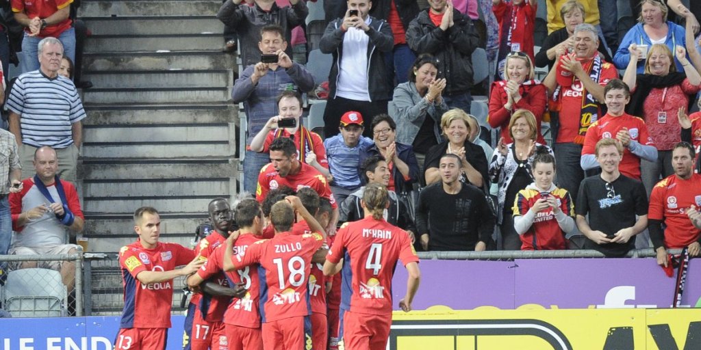 Adelaide United players celebrate a goal during last Friday's match against Sydney FC at Hindmarsh Stadium. Photo: AAP