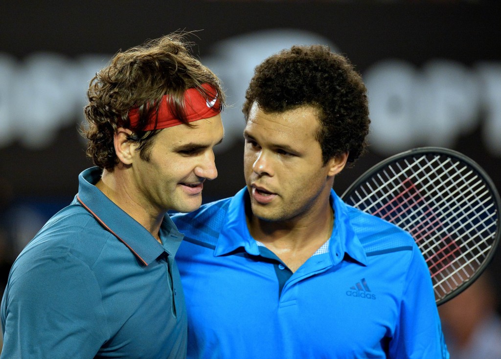 Federer (left) is all smiles after beating Tsonga
