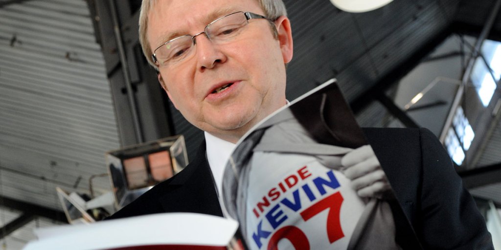 Then Prime Minister Kevin Rudd in 2008 with a journalist's book about his successful election campaign.