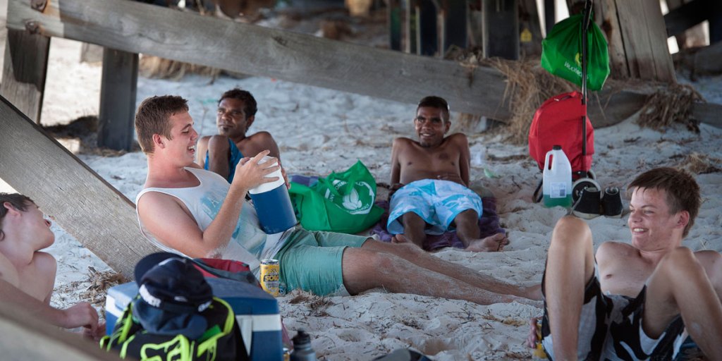 Beach-goers escape the sun Thursday under the Semaphore jetty.