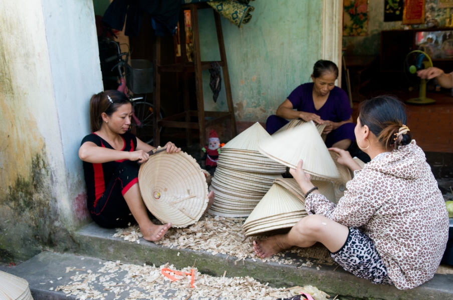 Vietnamese women making hats near Hanoi