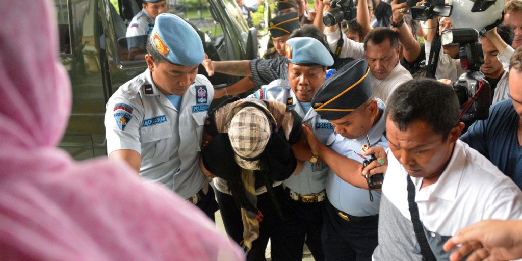 Schapelle Corby is escorted by police and prison officials at the prosecutor's office after she was freed from prison on parole this morning.