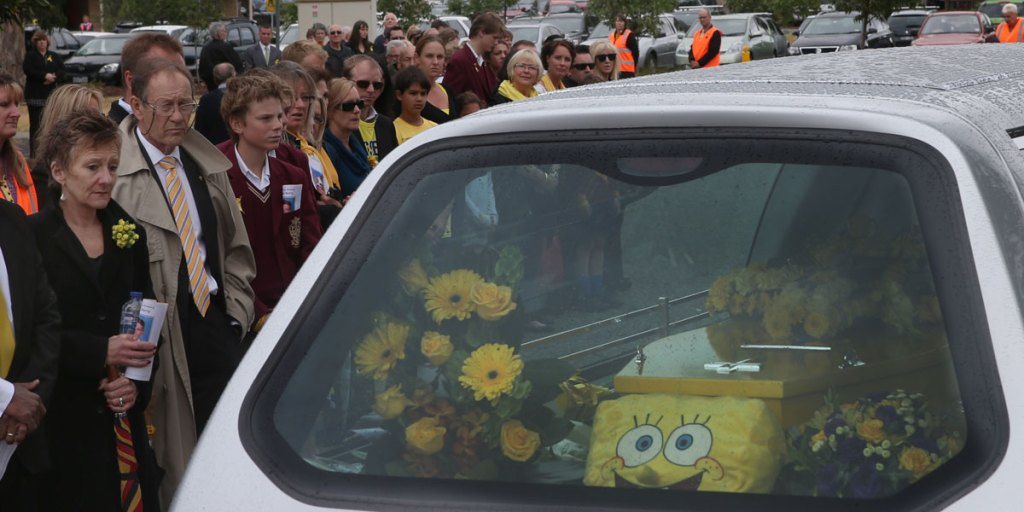 Mourners form a guard of honour after the funeral of 11-year-old Luke Batty on Friday. Luke was killed by his estranged father.