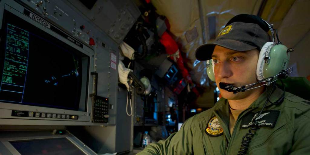 Royal Australian Air Force Airborne Electronics Analyst, Sergeant Ben Herbert, monitors his screens during the search for missing Malaysia Airlines flight MH370 off the coast of Western Australia.