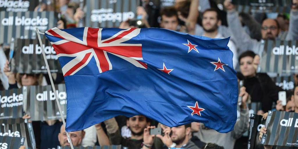 Flying the New Zealand flag at an All Blacks rugby match.