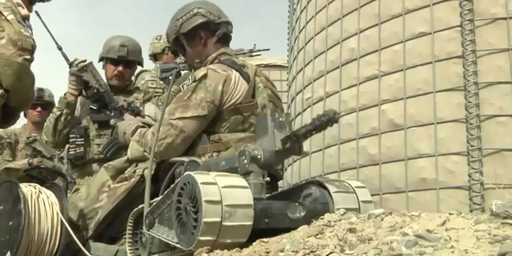 Soldiers training with a PackBot tactical robot.