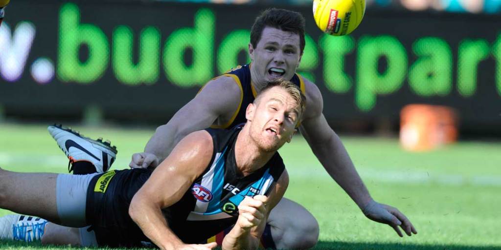 Port's Robbie Gray beats Adelaide's Patrick Dangerfield to the ball. Image; AAP