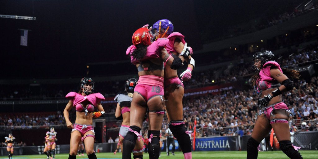 "Lingerie" football players celebrate a touchdown during a demonstration match in Sydney in 2012.