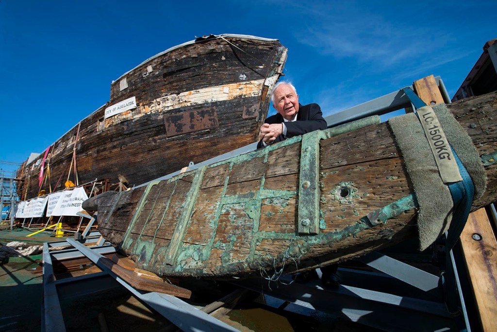 Jim Tildesley with the City of Adelaide rudder. Image by Brenton Edwards