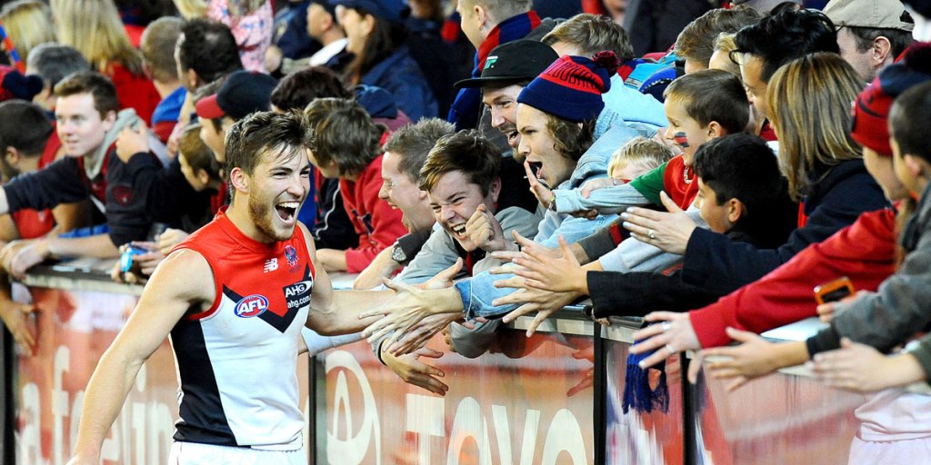 Young Melbourne midfielder Jack Viney celebrates with fans after the Demons' one-point win over Essendon.