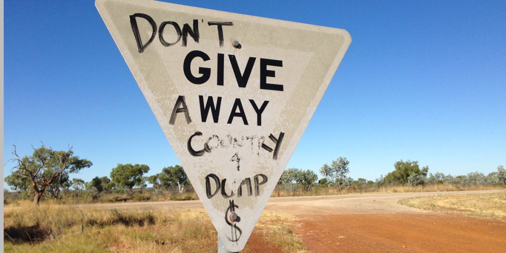 A protest scrawled on a sign at the Stuart Highway turn-off to Muckaty Station, 120km north of Tennant Creek.