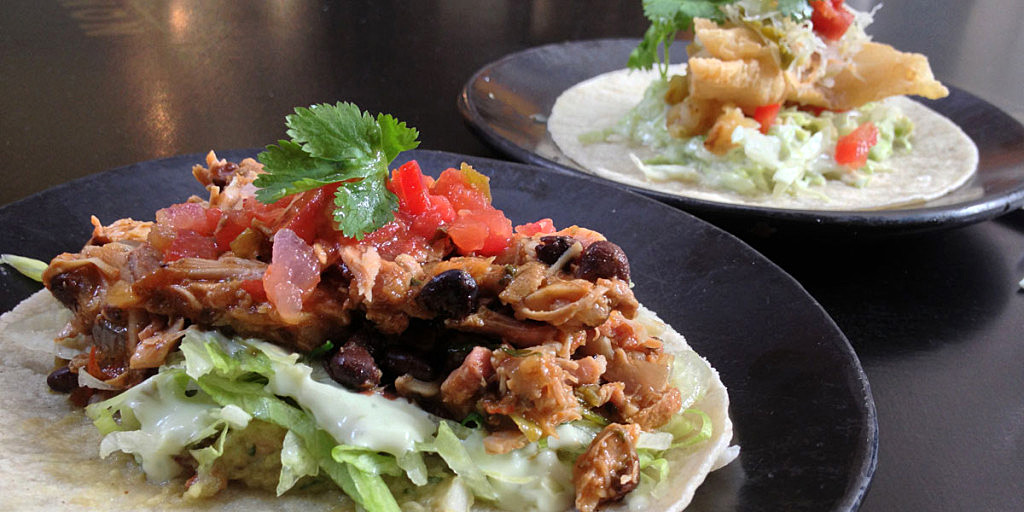 The generous taco de pollo y tocino (front) and the fish taco at ULC.