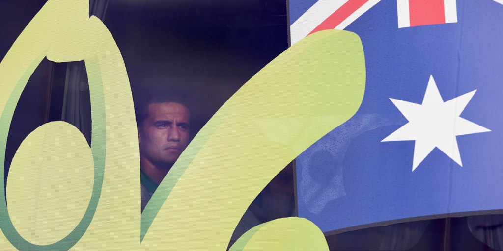 Tim Cahill sits on the team bus after an afternoon walk on the beach in Brazil. AFP photo