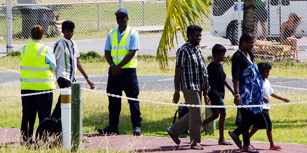 The asylum seekers arrive at Cocos Island yesterday. Photo: AAP