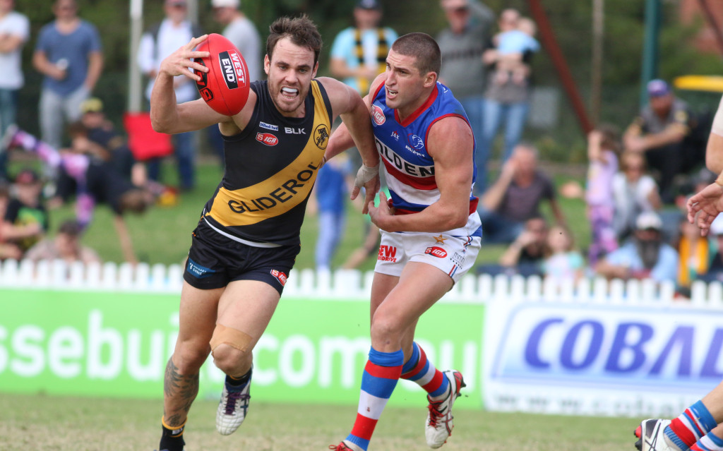 Glenelg's Sam Lonergan  and Central's Tim McIntyre. Image by Peter Argent