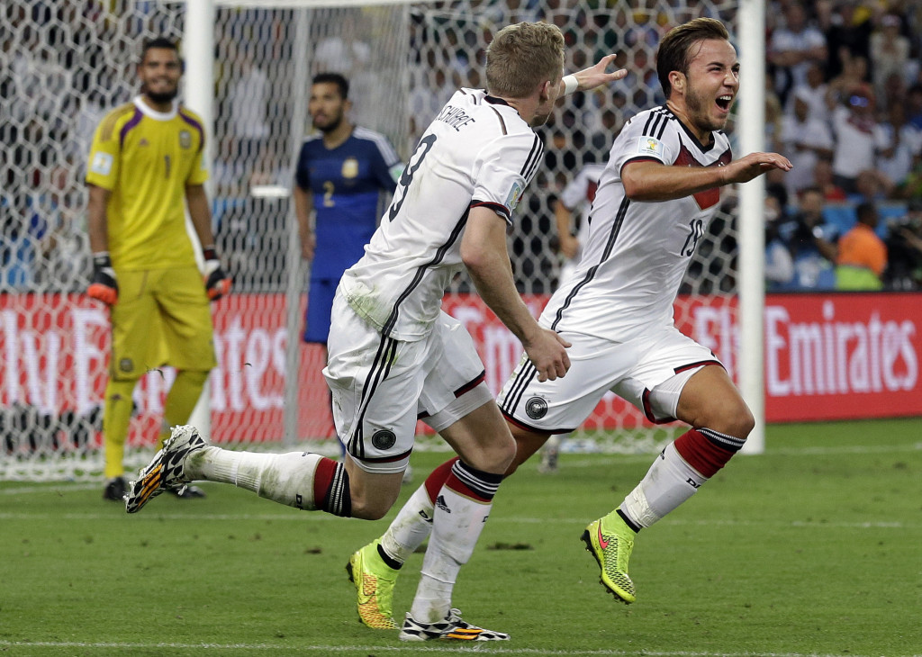 Germany's Mario Goetze, right, celebrates after scoring the only goal of the World Cup final between Germany and Argentina 
