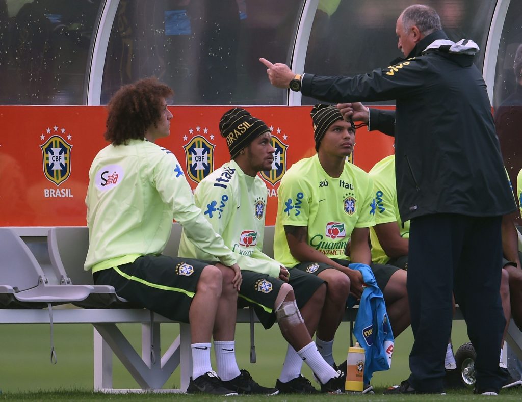 Brazil's coach Luiz Felipe Scolari (R) speaks with his young players