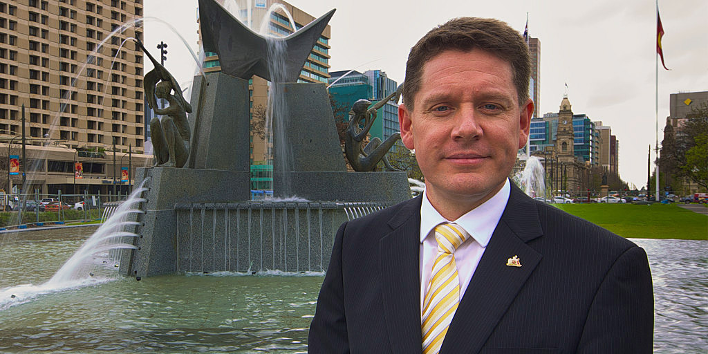 Former Lord Mayor Stephen Yarwood in front of the reconstructed Three Rivers Fountain.