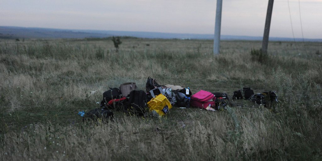 Luggage from the crashed jet in a field in the Ukraine. AFP photo