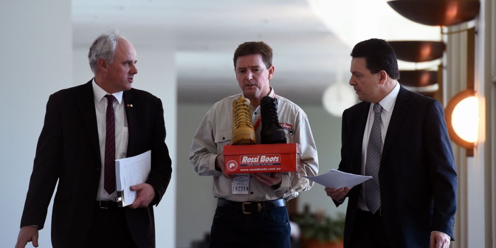 Rossi Boots CEO Neville Hayward (centre) with Senator John Madigan (left) and Senator Nick Xenophon (right) in Canberra this week.