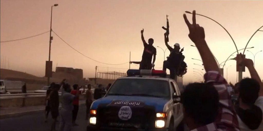 Alleged Islamic State of Iraq and the Levant (ISIL) militants taking part in a parade in the northern Iraqi city of Mosul in June.