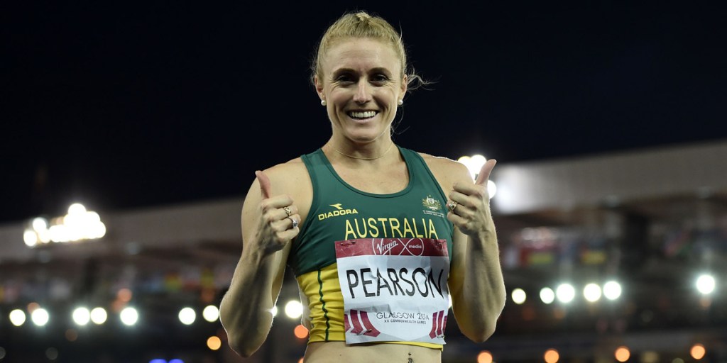 Sally Pearson gives a thumbs-up after winning her heat of the women's 100m hurdles. Photo: AAP