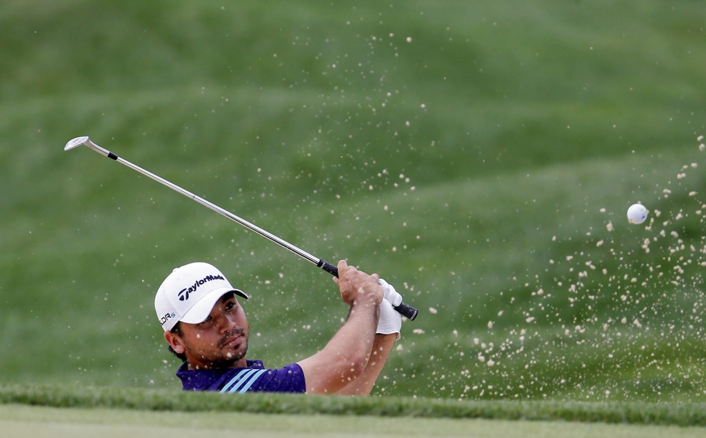 Jason Day gets out of a bunker