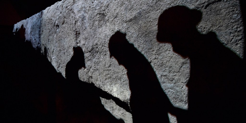 Images of WWI soldiers projected onto a re-created trench at the launch of a new exhibition this month at London's Imperial War Museum. Photo: AFP