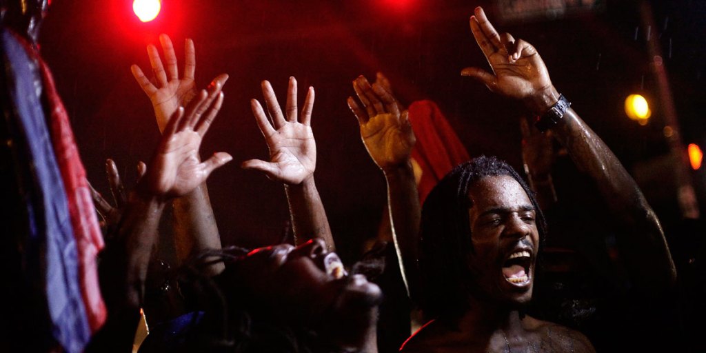 Demonstrators protest against the August 9 police shooting of 18-year-old Michael Brown.