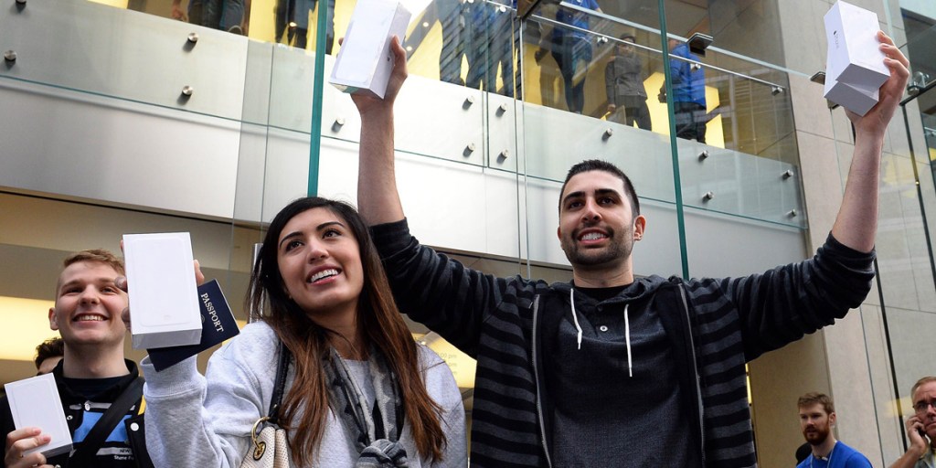 Buyers with their new IPhone 6. Photo: AAP