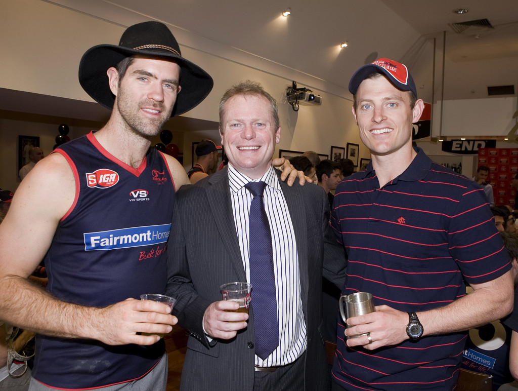 Norwood's captain Kieran McGuinness with brewery boss Jake Parkinson and coach Ben Warren

